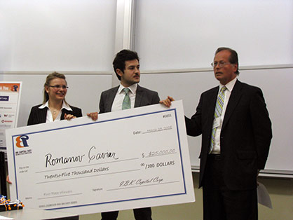 Team Romanov Caviar holding winning cheque from MBA Ivey Business Plan Competition 2008